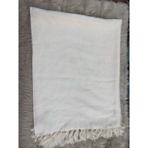 West Elm off white fringe throw blanket.